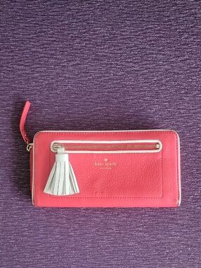 kate spade Coral Pink Leather Zip Wallet with White Tassel